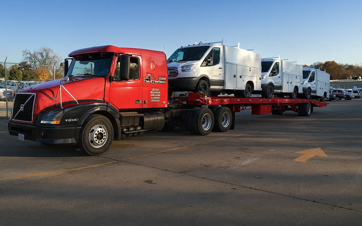 Xclusive Freightliner loaded with vehicles
