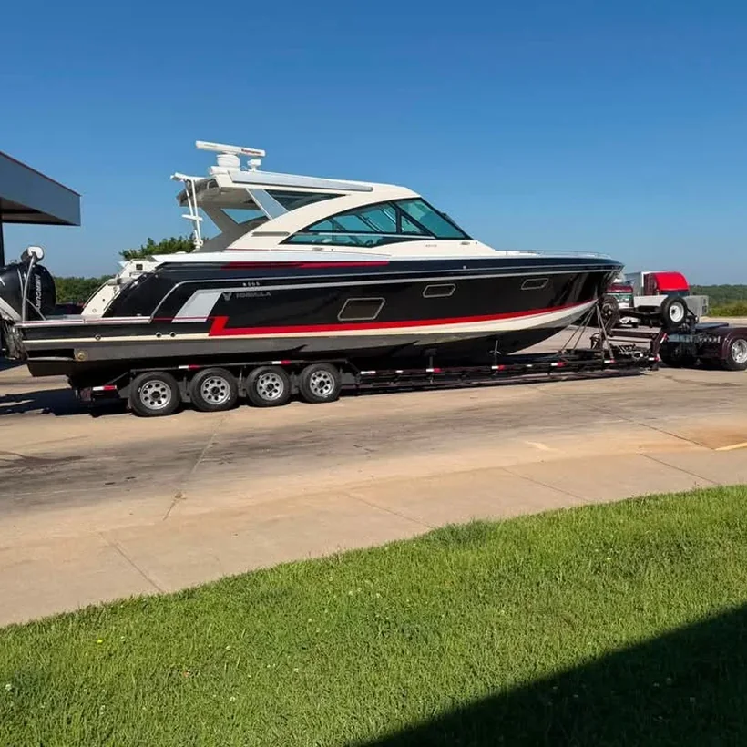 Boat prepped, shrink wrapped and strapped down on the trailer before departure